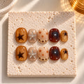 Caramel Constellation press-on nails styled