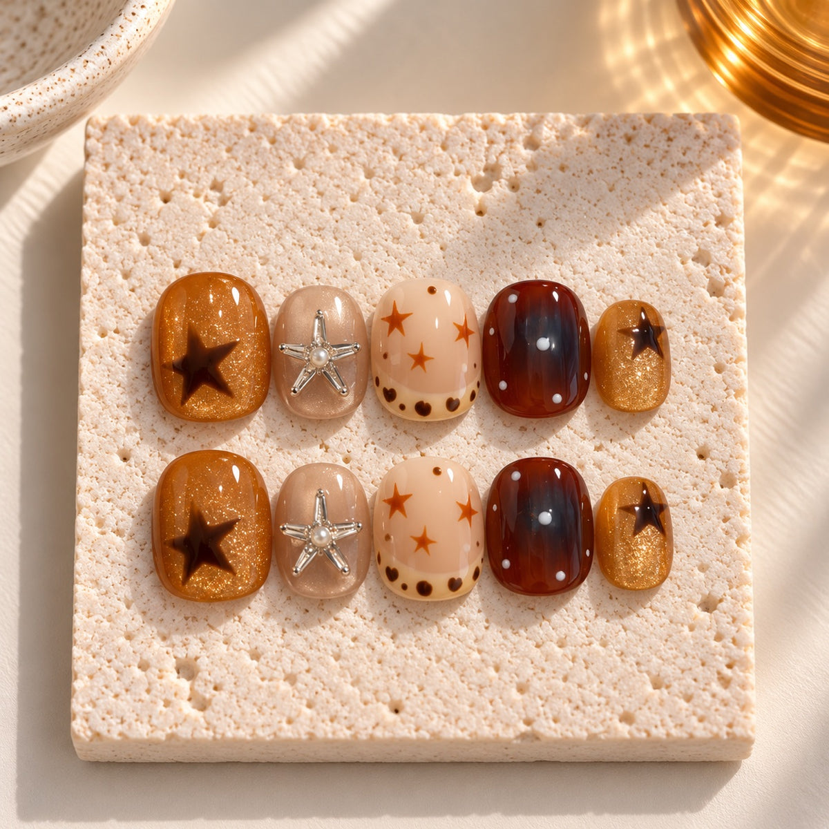Caramel Constellation press-on nails styled
